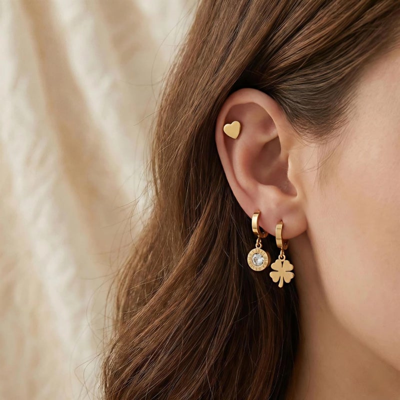 A set of three pairs of gold earrings; combining a delicate heart-shaped design, dangling circles with sparkling zircon stones, and a charming dangling rose. Made of durable stainless steel for a unique look. - Image 4